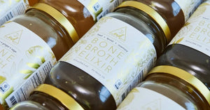 Multiple jars of bone broth elixir infused with healing antioxidant herbs for broth.