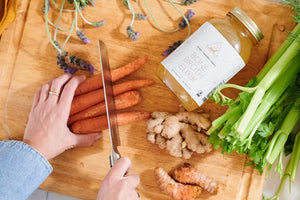 Jar of OWL chicken bone broth with carrots, ginger and celery