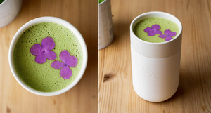Hemp Matcha Latte in two images: the first shows a close-up of the green latte topped with two purple edible flowers in a ceramic cup; the second displays the latte in a sleek white OWL-branded travel cup on a wooden table 